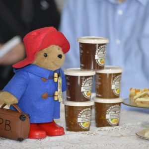 Paddington Bear with an assortment of jams